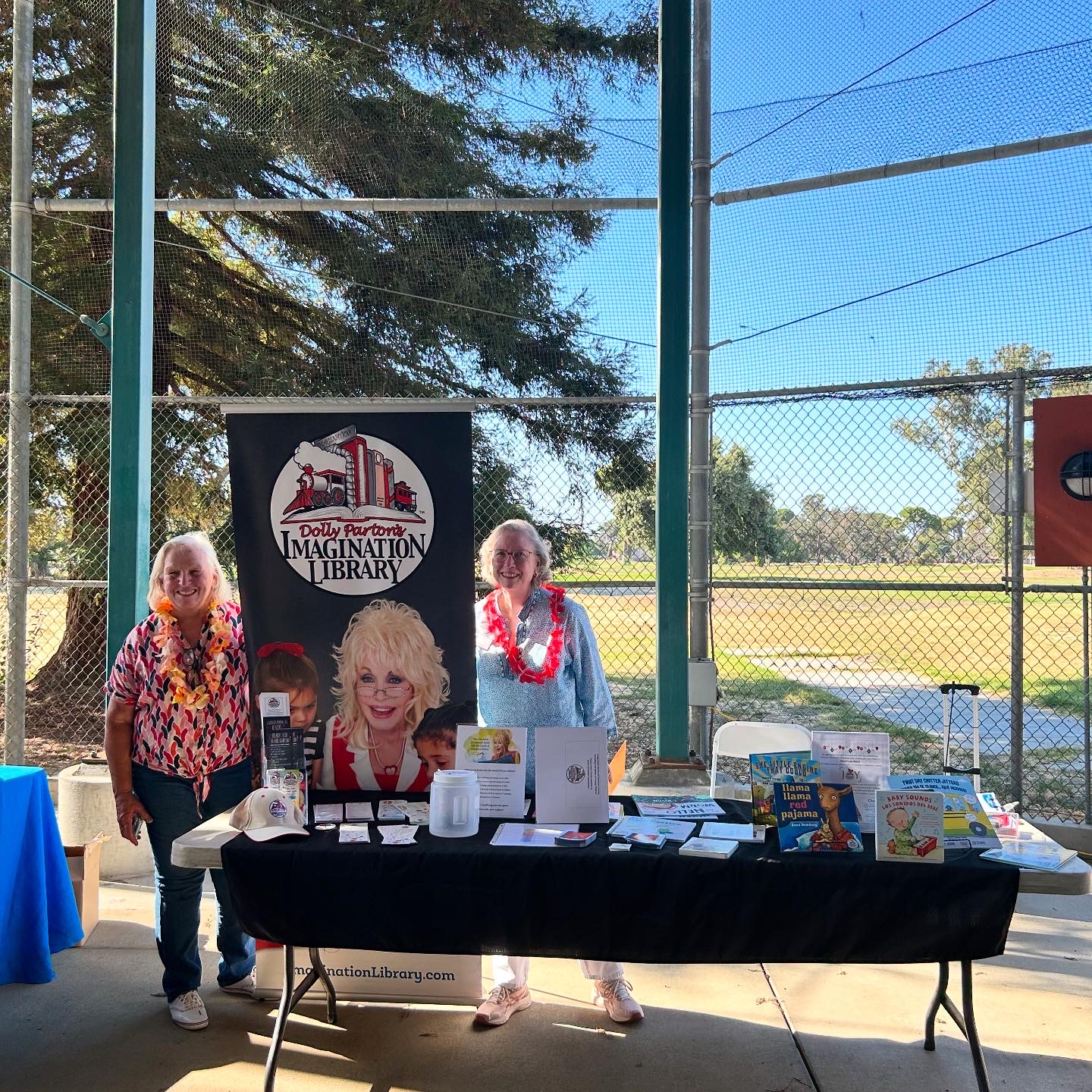 Adults at an Imagination Library booth
