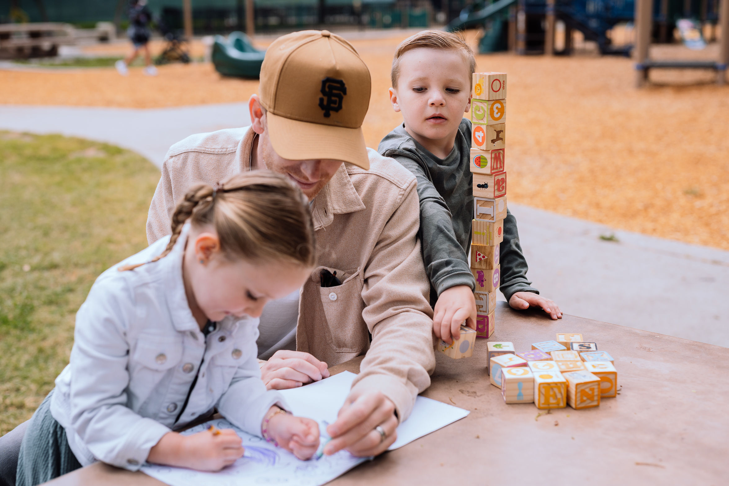 Kids Playing with Dad at Park